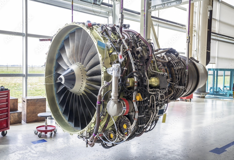 Commercial aircraft turbofan engine suspended in a hangar